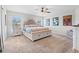 Bright bedroom with a large window, stylish decor, and an ornate upholstered bedframe at 6315 164Th E Ave, Parrish, FL 34219