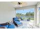 Cozy screened patio with comfortable seating, perfect for relaxing outdoors with a view at 6315 164Th E Ave, Parrish, FL 34219