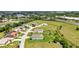A picturesque aerial view of a neighborhood with lush greenery and beautiful homes, showcasing the community's charm at 7028 N Plum Tree, Punta Gorda, FL 33955