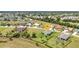 Aerial view of a blue home on a large grassy lot in a well-established residential area at 7028 N Plum Tree, Punta Gorda, FL 33955