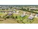A stunning birds-eye view of a community highlighting manicured lawns, mature trees, and spacious residences at 7028 N Plum Tree, Punta Gorda, FL 33955