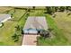 High angle of a home with two car garage with mature trees and green lawns in an expansive lot at 7028 N Plum Tree, Punta Gorda, FL 33955