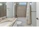 Bathroom features a tub-shower, tiled walls, and a granite countertop at 7028 N Plum Tree, Punta Gorda, FL 33955