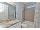 Bright bathroom features a granite countertop, shower-tub combination with neutral tiled walls at 7028 N Plum Tree, Punta Gorda, FL 33955