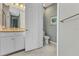 Bathroom features a white vanity, granite counters, and tiled floors at 7028 N Plum Tree, Punta Gorda, FL 33955