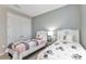 Comfortable ' bedroom with twin beds, seashell themed headboards and neutral decor at 7028 N Plum Tree, Punta Gorda, FL 33955