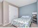 Comfortable bedroom with carpet, closet, and a side table with lamp at 7028 N Plum Tree, Punta Gorda, FL 33955
