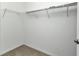 Small, walk-in closet has neutral carpet and basic wire shelving at 7028 N Plum Tree, Punta Gorda, FL 33955