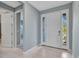 Bright entryway with tile floors, and white entry door at 7028 N Plum Tree, Punta Gorda, FL 33955