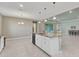 Open kitchen with large island, granite countertops, and stainless steel appliances at 7028 N Plum Tree, Punta Gorda, FL 33955