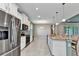 Spacious kitchen with granite counters, a central island and stainless steel appliances at 7028 N Plum Tree, Punta Gorda, FL 33955
