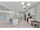 Bright, open-concept kitchen featuring a center island with bar seating and stainless steel appliances at 7028 N Plum Tree, Punta Gorda, FL 33955