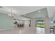 Open-concept living space with recessed lighting, bar seating, and outdoor views at 7028 N Plum Tree, Punta Gorda, FL 33955