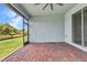 Screened patio with ceiling fan has brick flooring and views of the backyard at 7028 N Plum Tree, Punta Gorda, FL 33955