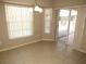 Bright dining area with sliding door access to the screened patio and private pool at 7500 Ligustrum, Punta Gorda, FL 33955