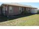 Exterior side of home showcases neat landscaping and trimmed lawn at 7500 Ligustrum, Punta Gorda, FL 33955