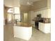 Open kitchen design with granite counters, stainless appliances, tile flooring and natural light at 7500 Ligustrum, Punta Gorda, FL 33955
