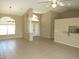 Bright living room with tile floors, neutral walls, ceiling fan, and plenty of space for entertaining at 7500 Ligustrum, Punta Gorda, FL 33955