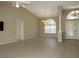 Spacious living room with tile flooring, vaulted ceilings, ceiling fan, and lots of natural light at 7500 Ligustrum, Punta Gorda, FL 33955