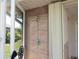 Tiled outdoor shower providing convenience and style by the pool area at 7500 Ligustrum, Punta Gorda, FL 33955