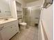 Standard bathroom with a vanity, toilet, and shower with sliding glass doors at 1081 E Corktree Cir, Port Charlotte, FL 33952