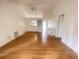 Spacious living room with hardwood floors and a vaulted ceiling, offering ample space at 1081 E Corktree Cir, Port Charlotte, FL 33952