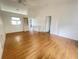 Bright living room featuring hardwood floors, built in shelving, and lots of natural light at 1081 E Corktree Cir, Port Charlotte, FL 33952