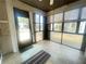 Enclosed sunroom with tiled floors, offering a cozy, relaxing space at 1081 E Corktree Cir, Port Charlotte, FL 33952