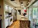 Efficient kitchen with white cabinets, marble-look countertops, and stainless steel appliances at 1148 Barbour Ave, Port Charlotte, FL 33948