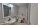 Updated bathroom featuring a sink, toilet, shower, and tiled floors at 131 Spring Lake Nw Blvd, Port Charlotte, FL 33952