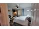 This bedroom has two beds, closet and a ceiling fan with hardwood floors and a grey rug at 131 Spring Lake Nw Blvd, Port Charlotte, FL 33952
