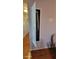 Hallway featuring built in ironing board and hardwood floors at 131 Spring Lake Nw Blvd, Port Charlotte, FL 33952