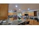 Well-appointed kitchen features stainless steel appliances, granite countertops, and ample cabinet space at 131 Spring Lake Nw Blvd, Port Charlotte, FL 33952