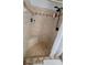 Tiled shower with built-in seat and recessed shelving, and dual shower heads at 131 Spring Lake Nw Blvd, Port Charlotte, FL 33952