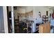 A utility sink with shelving in an unfinished room with storage at 131 Spring Lake Nw Blvd, Port Charlotte, FL 33952