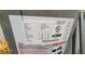 Close-up of a water heater with detailed specs and safety warnings at 131 Spring Lake Nw Blvd, Port Charlotte, FL 33952