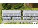 Aerial view of community buildings with parking and beautiful landscaping at 14281 Heritage Landing Blvd # 1418, Punta Gorda, FL 33955