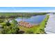 Aerial view of a lake and surrounding green landscape near residential properties at 14281 Heritage Landing Blvd # 1418, Punta Gorda, FL 33955