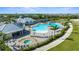 Aerial view of the community pool, tennis courts and clubhouse at 14281 Heritage Landing Blvd # 1418, Punta Gorda, FL 33955