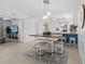 Charming dining area with a rustic table, seating for four, and views of the kitchen and living areas at 14281 Heritage Landing Blvd # 1418, Punta Gorda, FL 33955