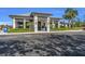 Attractive building exterior with manicured landscaping and convenient parking, near palm trees and greenery at 14281 Heritage Landing Blvd # 1418, Punta Gorda, FL 33955