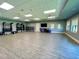 Well-lit fitness room with ample space for exercise and a variety of equipment, plus TV screens at 14281 Heritage Landing Blvd # 1418, Punta Gorda, FL 33955