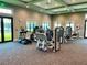 Well-equipped gym offering treadmills, weight machines, and ample natural light from large windows at 14281 Heritage Landing Blvd # 1418, Punta Gorda, FL 33955
