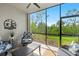 Relaxing lanai with comfortable seating and views of the lush green landscaping at 14281 Heritage Landing Blvd # 1418, Punta Gorda, FL 33955