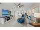 Spacious living room with a television, comfortable seating, and an open layout that connects to the kitchen at 14281 Heritage Landing Blvd # 1418, Punta Gorda, FL 33955