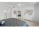 Bright bedroom provides open floorplan with white bureau and view to open concept living area at 14281 Heritage Landing Blvd # 1418, Punta Gorda, FL 33955