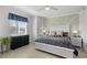 Comfortable primary bedroom with a white bed frame, neutral tones, and ample natural light from the window at 14281 Heritage Landing Blvd # 1418, Punta Gorda, FL 33955
