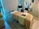 Relaxing massage room with neutral tones, soft lighting, and a comfortable massage table at 14281 Heritage Landing Blvd # 1418, Punta Gorda, FL 33955