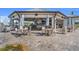 Spacious patio area with outdoor seating and umbrellas for shade, near an open-air bar at 14281 Heritage Landing Blvd # 1418, Punta Gorda, FL 33955