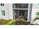 Ground-level screened lanai featuring comfortable seating and peaceful views at 14281 Heritage Landing Blvd # 1418, Punta Gorda, FL 33955